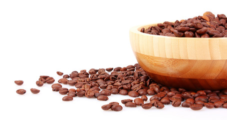 Plate with coffee beans isolated on white