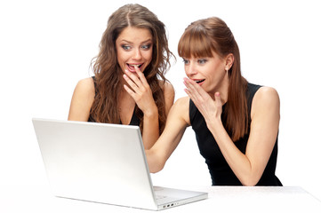 Two women working on a laptop