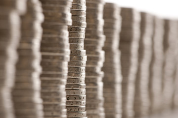 Close-up stacks of 2 Euros Coins in front of white background