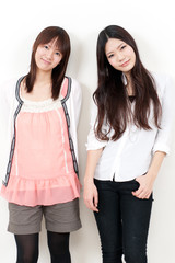 Obraz premium a portrait of two asian girl