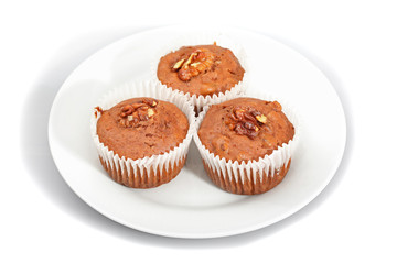 Three muffin on plate  isolated on white