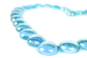 abstract background with blue glass balls heart shape, isolated