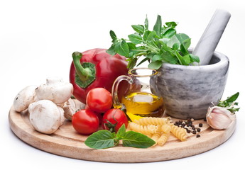 Mortar, herbs and vegetables.