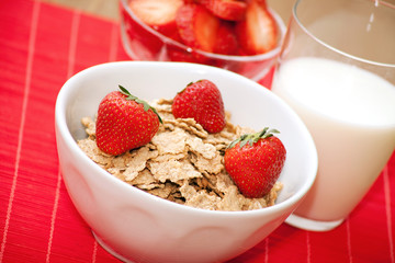breakfast cereal, milk and strawberries