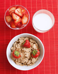 breakfast cereal with milk and strawberries