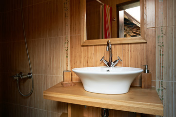 Bathroom interior with wooden theme
