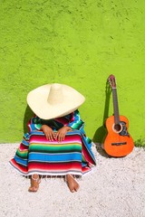 Typical mexican sombrero man sitting