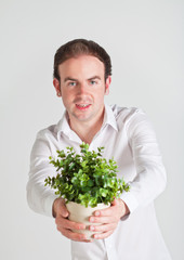 Young man with plant