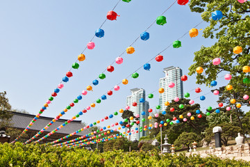Colorful lanterns hanging near buddhist temple © fdsmsoft