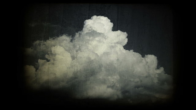 Vintage time lapse clip of white fluffy clouds