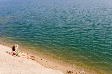 Summer woman in bikini alone on beach