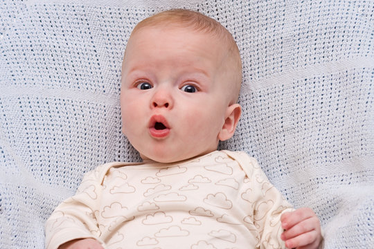 The surprised child on a light background