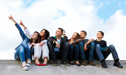 happy group of friends smiling outdoors