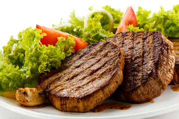 Grilled steaks and vegetables