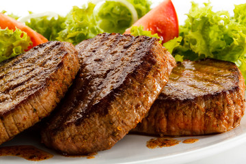 Grilled steaks and vegetables