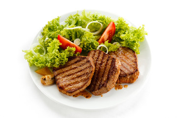 Grilled steaks and vegetables