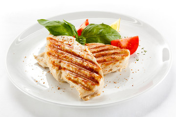 Grilled chicken breasts and vegetables