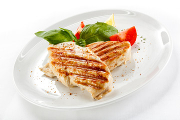 Grilled chicken breasts and vegetables