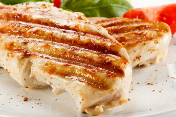 Grilled chicken breasts and vegetables