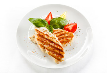 Grilled chicken breasts and vegetables