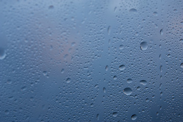 Water droplets on the glass surface.
