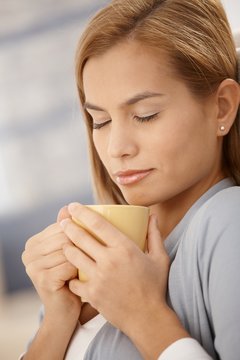 Beautiful woman having hot tea