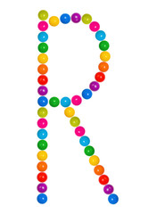 Letter R from plastic children's balls on the white