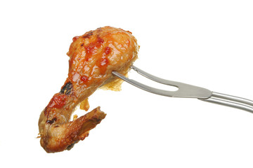 Chicken leg on fork