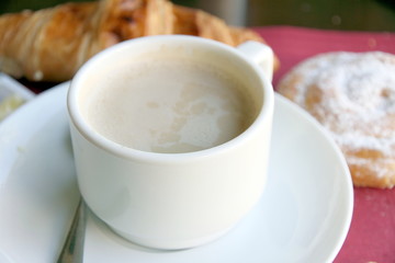 Coffee with croissant and ensaimada pastry from Spain