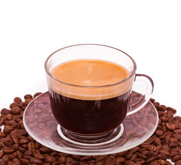 The cap of black coffee standing on grains