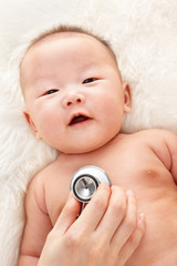 Being examined by pediatrician