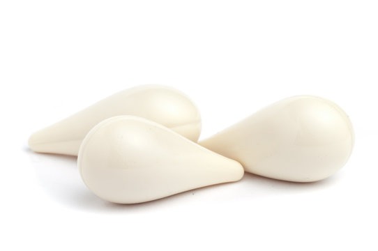 White suppositories on a white seamless background