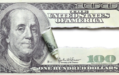 Torn dollar banknote