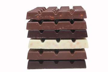 Close up of chocolate pieces on white background