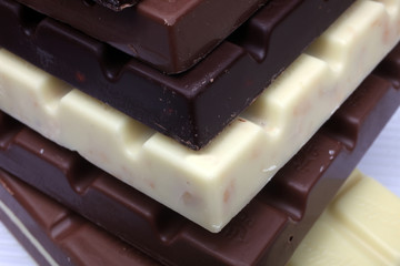 Close up of chocolate pieces on white background