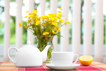 Cup of tea with teapot