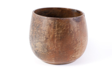 Clay pot of brown color on a white background