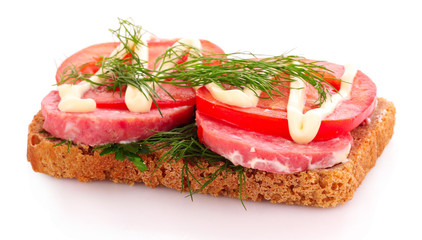 tomatoes and sausage on bread isolated on white