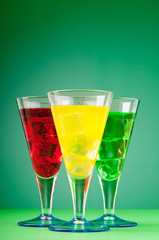 Colourful cocktail in glasses with ice