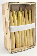 Fresh asparagus standing in a wooden box