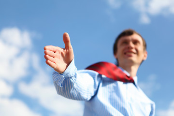 young businessman in a blue shirt and red tie