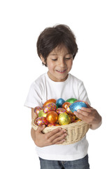 Fototapeta na wymiar Little boy with chocolate easter eggs