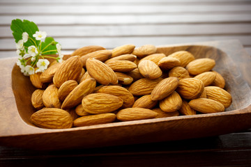 Almonds in wooden bowl
