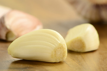 Composition with fresh garlic on kitchen table
