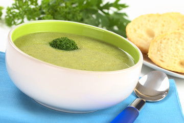 Cream of broccoli garnished with a broccoli floret