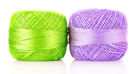 Two thread bobbins isolated on white