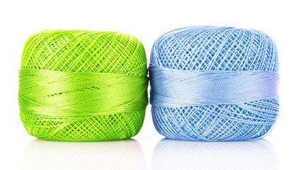 Two thread bobbins isolated on white