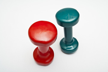 Red and green dumbbells hand weight.