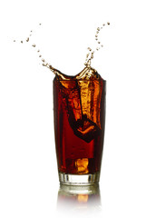 Ice cube droped in cola glass