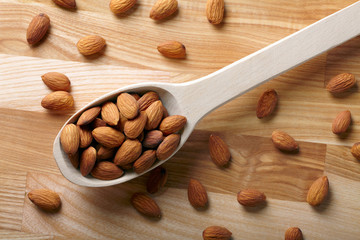Almonds on wooden background